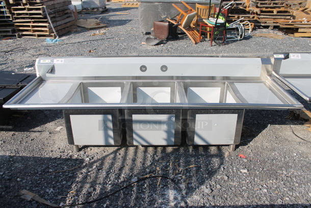 BRAND NEW SCRATCH AND DENT! Regency 600S31824218 Stainless Steel Commercial 3 Bay Sink w/ Dual Drain Boards. Bays 18x24. Drain Boards 16.5x25.5 - Image 1 of 8