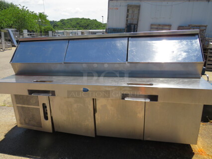 One Randell 3 Door Refrigerated Pizza Prep Table On Casters. WORKING WHEN REMOVED. Model# PH96E3. 115 Volt. 96X40.5X55