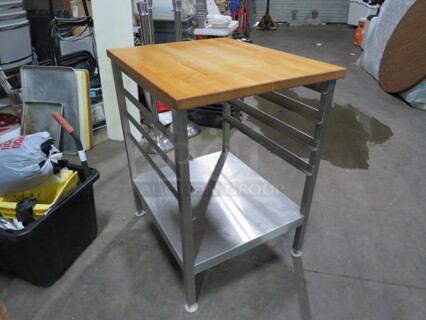 One Stainless Steel Speed Rack With A Butcher Block Top. 24X30X35.5