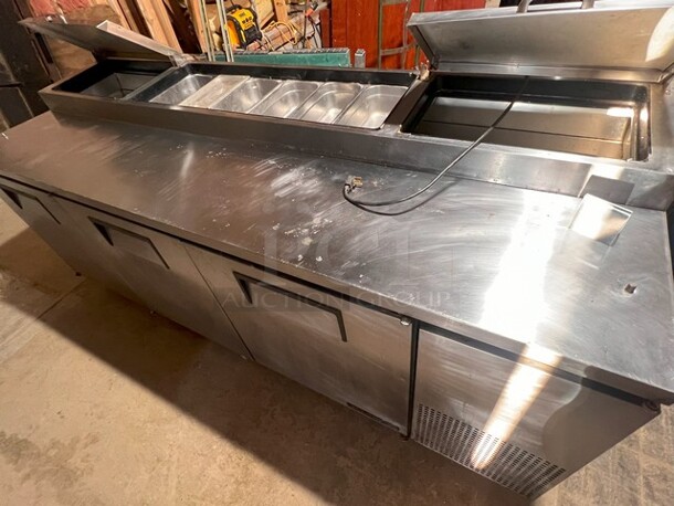 True 93" Pizza Prep Table W/Refrigerated Base on Casters, 115v, Stainless Steel, Missing Center Top Lid and Cutting Board. Very Clean, NOT TESTED 
Model TPP-93 - Image 1 of 6