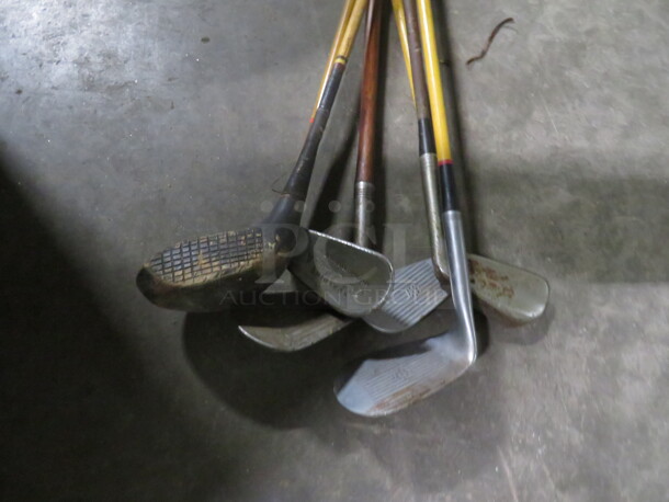 One Lot Of Golf Clubs.