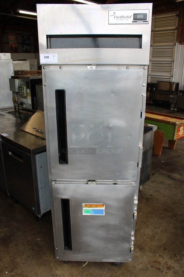2012 Delfield Model 6125XL-SH Stainless Steel Commercial 2 Half Size Door Reach In Cooler on Commercial Casters. 115 Volts, 1 Phase. 25.5x33x80. Tested and Powers On But Does Not Get Cold
