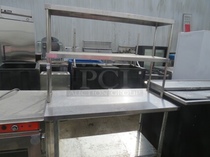 One Stainless Steel Table With Under Shelf And 2 SS Over Shelves. 48X24X65