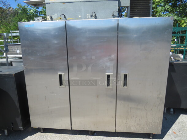 One Delfield 3 Door Refrigerator With 11 Racks On Casters. Working Not Cold. Model# 6076S. 115 Volt. 76X30X80. - Image 1 of 3