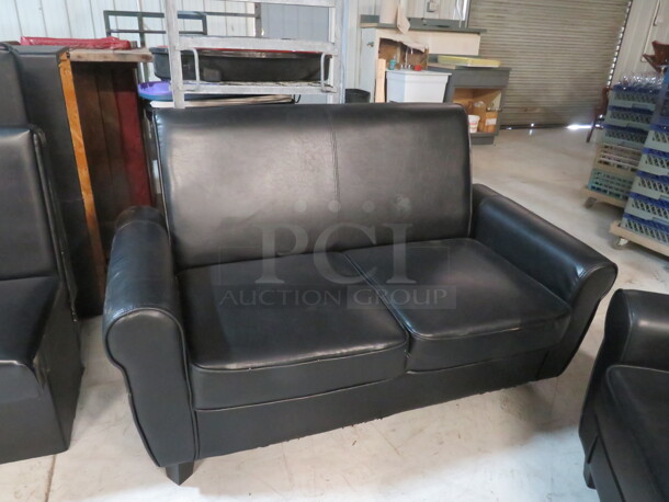 One Black Pleather Couch. 60X31X35 - Image 1 of 2