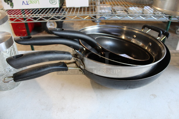 4 Various Metal Skillets. Includes 18x10.5x2. 4 Times Your Bid!