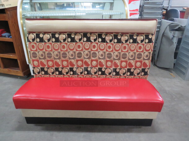 One Single Sided Booth With Red Cushioned Seat And Multi Colored Back. 60.5X26X45.5