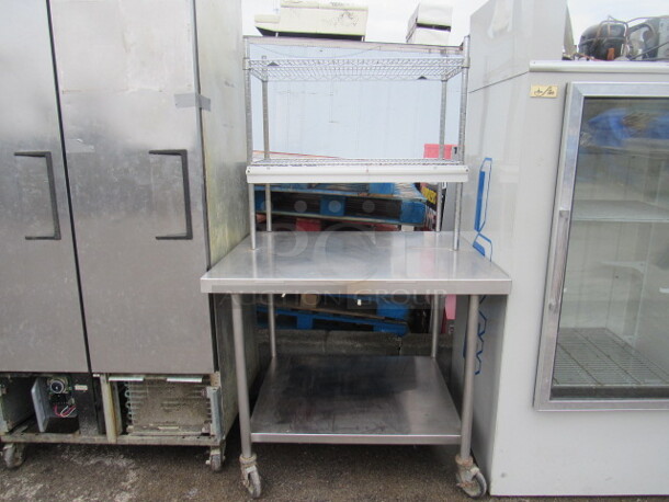 One Stainless Steel Table With Stainless Undershelf And 2 Metro Over Shelves, 36 Inch Ticket Rail, On Casters. 42X36X70 - Image 1 of 1
