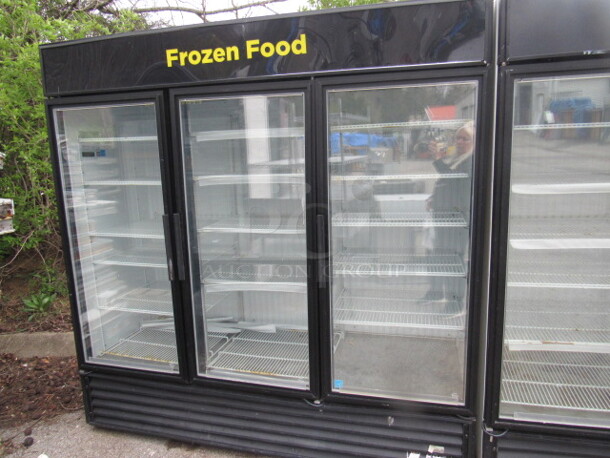 One 3 Door True Freezer With 16 Racks. 115/208-230 Volt. 1 Phase. Model# GDM-72FLD. Working When Removed. 