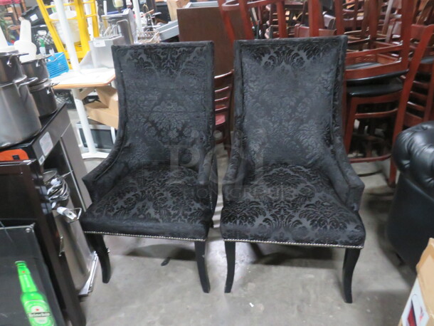 One Black Cushioned High Back Chair With Nail Head Trim.  - Image 1 of 3