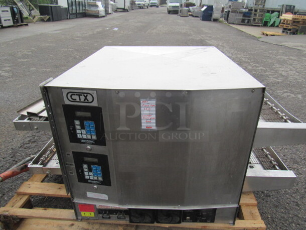 One CTX Double Conveyor Pizza Oven. Model# DZ33. 59X36X28.5