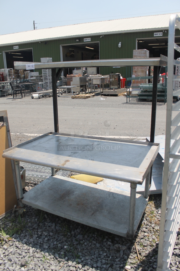 Commercial Stainless Steel Work Table With Both Overshelf And Undershelf On Commercial Casters.