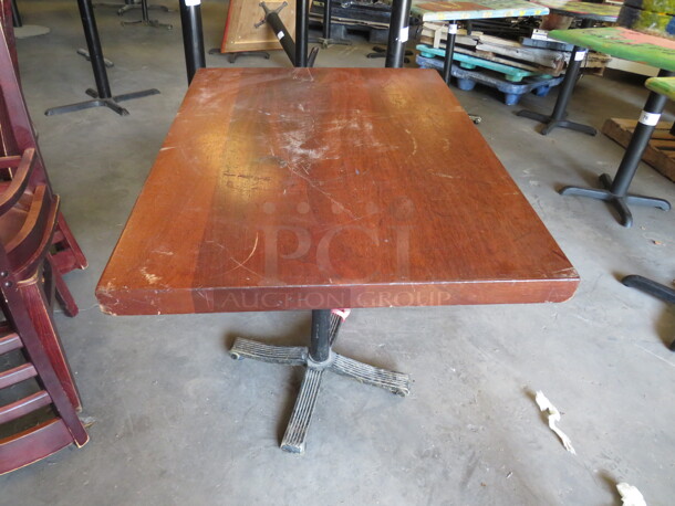 One 2 Inch Thick Wooden Table Top On A Pedestal Base. 32X24X30