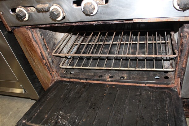 WOW! Garland 2 Burner Natural Gas Range With Griddle, 2 Full Size Ovens, Backsplash And Salamander Shelf. 75x31x59. Working When Pulled! - Image 4 of 6