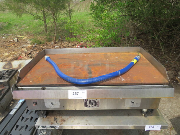 One Natural Gas Griddle, With Gas Hose. 36X24X16