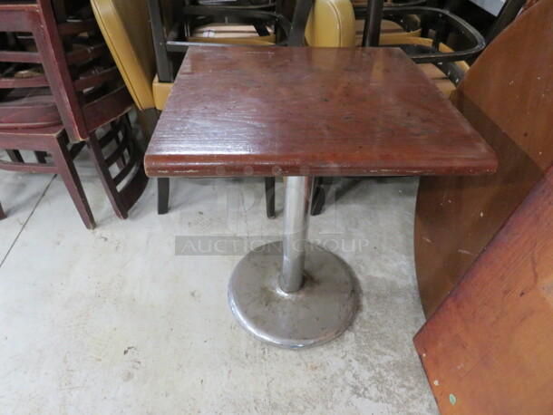 One 2 Inch Thick Solid Wooden Table Top On A Chrome Pedestal Base. 24X24X30