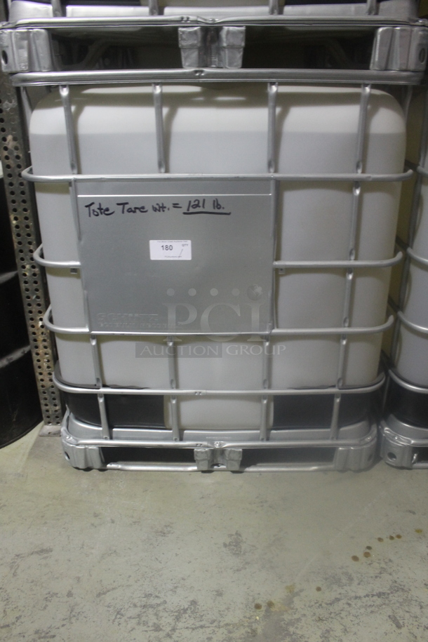 White Poly Tank in Metal Cage. BUYER MUST REMOVE. - Image 1 of 3