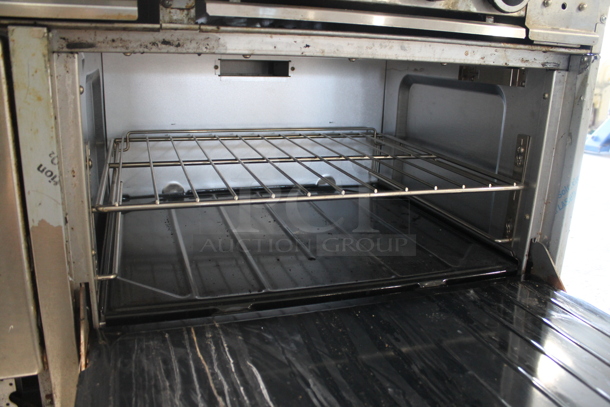 Garland SunFire Stainless Steel Commercial Natural Gas Powered 6 Burner Range w/ Right Side Flat Top Griddle, 2 Ovens, Over Shelf and Back Splash.  - Image 7 of 9