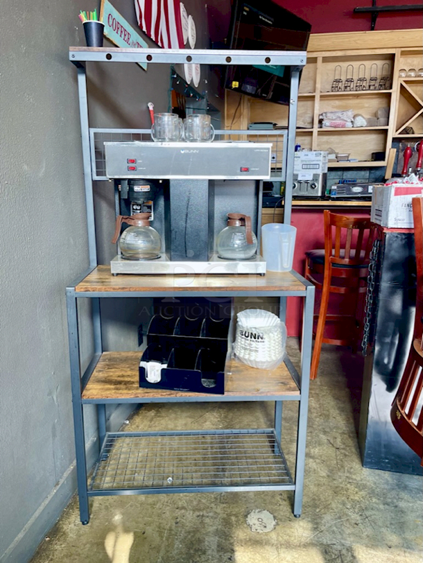 OUTSTANDING! Bunn Coffee Bar - Includes: Bunn 04275.0031 VPS 12 Cup Pourover Coffee Brewer with 3 Warmers - 120V (MODEL: VPS, BLK-LTD SW), 2 Coffee Decanters, 4 Glass Coffee Cups, Filters, Mind Reader Acrylic 9 Compartment Condiment Organizer, Black, FL310 Bakers Rack, Coffee Bar, Kitchen Storage Shelf Rack with Space For 10 Hooks, 3 Shelves, Adjustable Feet, for Microwave Oven. Combined Value of $850  - Image 1 of 8