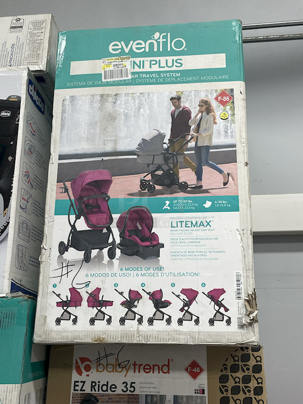 MASSIVE LOT! (3) Little Tikes 2-In-1 Snug & Secure Swings – 1 Blue, 2 Pink; (17) Nuby Water Resistant Baby Bibs (assorted colors); (1) Graco “Caden Fashion” Comfy Cruiser™ Travel System With Snugride® 30; (1) Allen YOOGO CZ2 Convertible Cargo Trailer → Handy Pull Cart,  (1) Delta Children Sweet Slumber Bassinet, (1) Chicco LullaGo Portable Bassinet, (1) Chicco NextFit Sport Convertible Car Seat, (2) Evenflo Omni Plus Modular Travel System – Includes LITEMAX Rear-Facing Infant Car Seat, (1) Baby Trend EZ Ride Girl 35 - Includes NEW 4-35 Ibs Infant Car Seat , (1) Evenflo Nurture Infant Car Seat Base. 11x Your Bid - Image 8 of 12