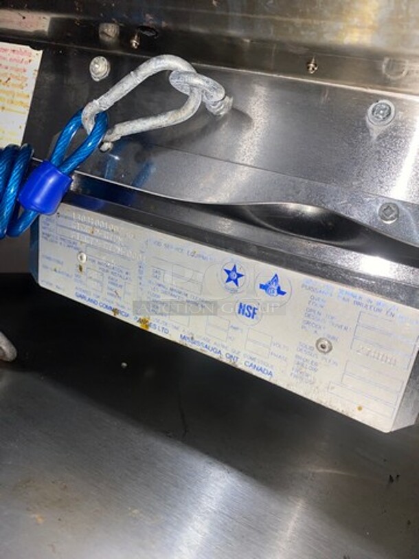NICE! Garland Heavy Duty Commercial Countertop Gas Powered Flat Griddle! 1-Inch-Thick Plate! With Back And Side Splashes! On Equipment Stand! With Storage Space Underneath! All Stainless Steel! Model GTGG72G72M Serial 1303100100266! On Casters! WORKING WHEN REMOVED! - Image 8 of 9