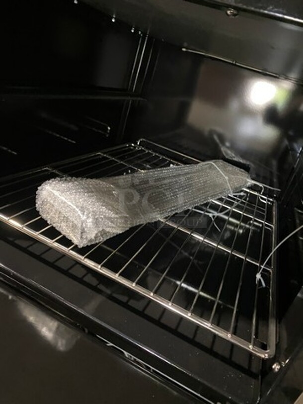 AWESOME! NEW! Migali Commercial Natural Gas Powered 4 Burner Stove With Flat Griddle! Flat Griddle Has Side Splashes! With Raised Back Splash And Salamander Shelf! With 2 Oven Underneath! Metal Oven Racks! All Stainless Steel! On Casters! Model: CRO424GLNG SN: NGUSB100321071000920017 - Image 9 of 12