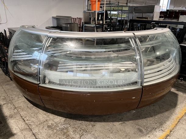 Metal Commercial Curved Remote Deli Display Case Merchandiser. Does Not Come w/ Compressors. Comes In Three Pieces. Pictures of Item In Use Are Attached. 63x39x56 Each Piece.