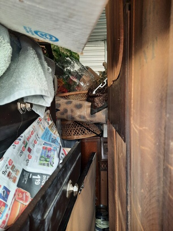 ALL ONE MONEY! Lot of Entire Contents of Storage Unit #29. Unit Size: 10 x 20. Unit Appears to Contain: Dressers, Bookshelves, Box Spring & Mattress, Wooden Bed, Couch, Chairs, Tables, Fan, Heaters, Bottle of Buttons, Longaberger Baskets, Lights, Mirror, Ironing Board, Rugs, Suitcases, Trashcan, Keurig, Blankets, Clothes, Shoes, Kerosene Heater, Large Stuffed Giraffe, Fake Plants, Bags, Totes & Boxes. Cleaning Deposit of $100 per Unit Paid on Pickup Day. Winner Has 7 Days From Close of Auction to Remove Items. All Items Must Be Removed and Unit Must Be Broom Swept to Get Cleaning Deposit Returned. Invoice and Cleaning Deposit Must Be Paid In Full by 4:00pm Tuesday, March 7th. Unit Must Be Cleared Out By 4:00pm Monday, March 13th. Please Come Into The Office To Settle Your Invoice and You Will Be Taken To Your Storage Unit for Cleanout. If You Plan To Clear Out Your Unit Saturday or Sunday You Need To Report To Our Office During The Week Before 4:00pm To Gain Access To Your Unit As Our Office Is Closed On Weekends. - Image 10 of 12