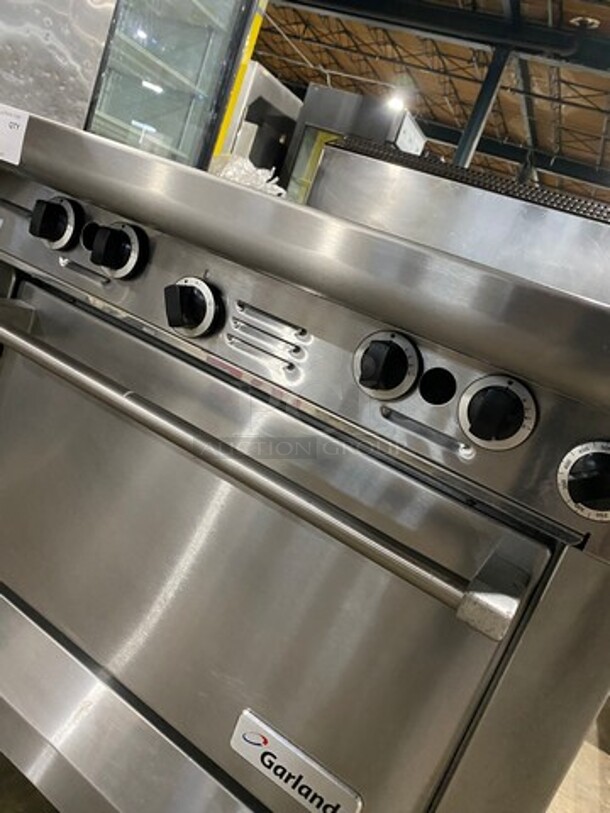 Garland Commercial Natural Gas Powered 4 Burner Stove! With Back Splash! With Oven Underneath! Metal Oven Rack! All Stainless Steel! On Casters! Model: M44R SN: 1601100100589 - Image 8 of 10