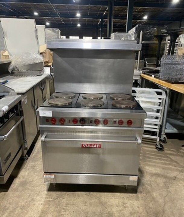 Nice! Vulcan Commercial 6 Burner Stove! With Raised Back Splash And Salamander Shelf! With Oven Underneath! Metal Oven Racks! All Stainless Steel! Model E36 Serial 485! 208/240V 1 Phase! Working When Removed! On Legs! - Image 1 of 11