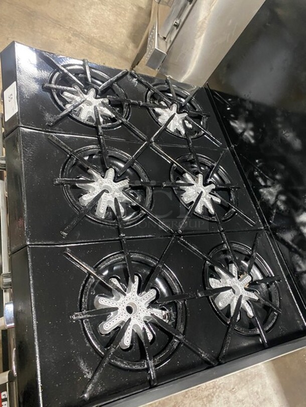 BEAUTIFUL! GARLAND All Stainless Steel Natural Gas Powered 6 Burner Range W/ Raised Right Side Flat Top W/ Cheese Melter! With 2 Ovens W/ Metal Racks! With Raised Over Back Splash & Slamander Shelf! On Legs! - Image 6 of 9