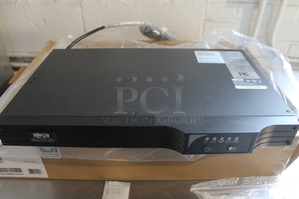 BRAND NEW IN BOX! Tripp-Lite Smart500RT1U Interactive UPS System.  - Image 1 of 3