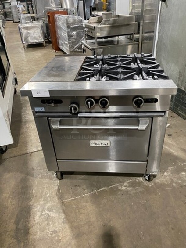 Garland Commercial Natural Gas Powered 4 Burner Stove With Hot Plate! with Oven Underneath! All Stainless Steel! On Casters! - Image 1 of 12