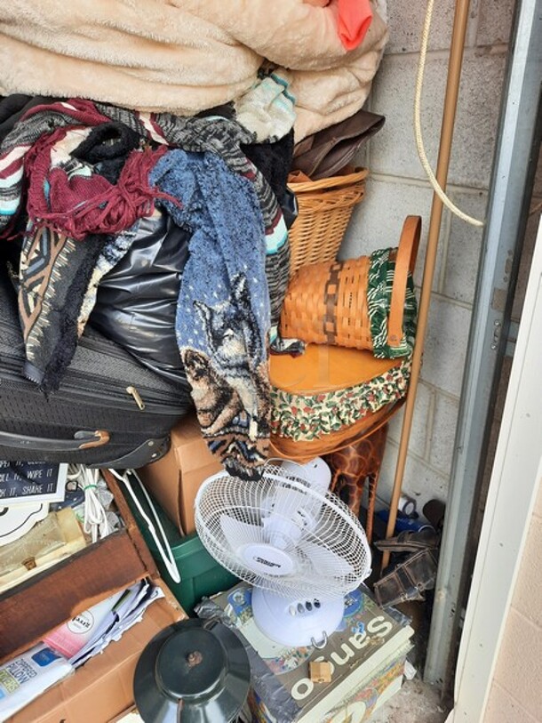 ALL ONE MONEY! Lot of Entire Contents of Storage Unit #29. Unit Size: 10 x 20. Unit Appears to Contain: Dressers, Bookshelves, Box Spring & Mattress, Wooden Bed, Couch, Chairs, Tables, Fan, Heaters, Bottle of Buttons, Longaberger Baskets, Lights, Mirror, Ironing Board, Rugs, Suitcases, Trashcan, Keurig, Blankets, Clothes, Shoes, Kerosene Heater, Large Stuffed Giraffe, Fake Plants, Bags, Totes & Boxes. Cleaning Deposit of $100 per Unit Paid on Pickup Day. Winner Has 7 Days From Close of Auction to Remove Items. All Items Must Be Removed and Unit Must Be Broom Swept to Get Cleaning Deposit Returned. Invoice and Cleaning Deposit Must Be Paid In Full by 4:00pm Tuesday, March 7th. Unit Must Be Cleared Out By 4:00pm Monday, March 13th. Please Come Into The Office To Settle Your Invoice and You Will Be Taken To Your Storage Unit for Cleanout. If You Plan To Clear Out Your Unit Saturday or Sunday You Need To Report To Our Office During The Week Before 4:00pm To Gain Access To Your Unit As Our Office Is Closed On Weekends. - Image 7 of 12