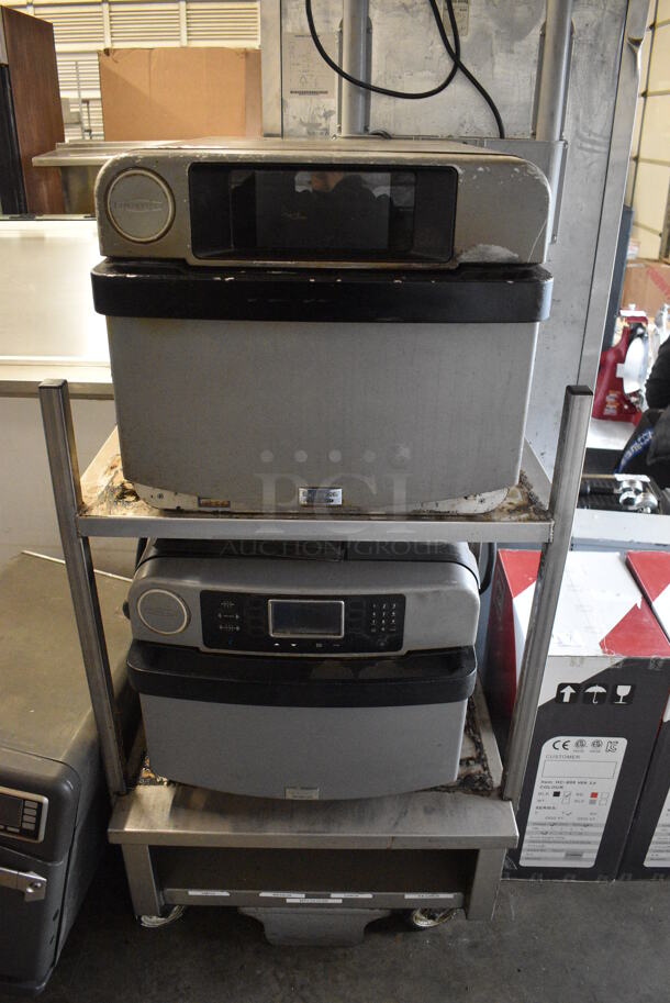 2 2013 Turbochef Encore 2 Metal Commercial Electric Powered Rapid Cook Ovens on Stainless Steel Double Stack Equipment Stand w/ Commercial Casters. 208/240 Volts, 1 Phase. 30x30x60. 2 Times Your Bid! Tested and Working!
