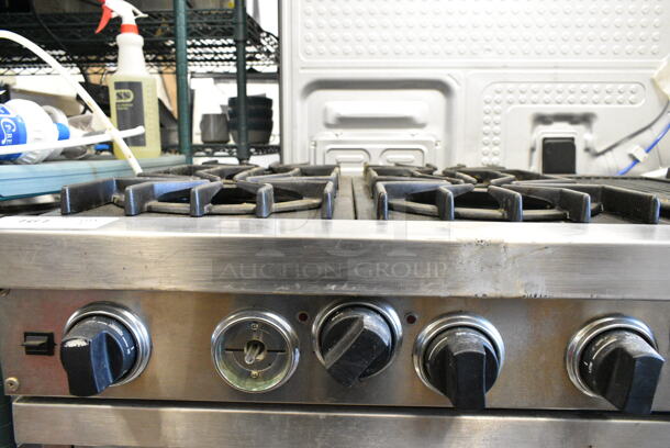 Viking Stainless Steel Natural Gas Powered 6 Burner Range w/ Charbroiler and 2 Ovens.  - Image 10 of 11