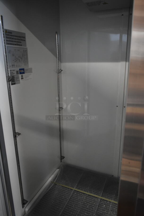 BRAND NEW SCRATCH AND DENT! 2024 Avantco 178A49FHC Stainless Steel Commercial 2 Door Reach In Freezer w/ Poly Coated Racks on Commercial Casters. 115 Volts, 1 Phase. Tested and Working! - Image 5 of 7