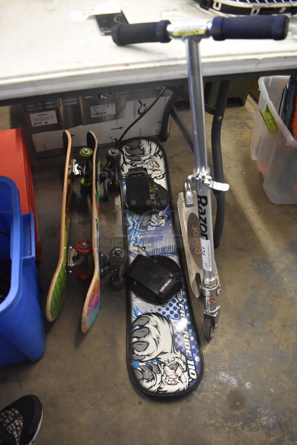 4 Various Outdoor Extreme Sports Items Including 2 Skateboards, Snowboard and Razor Scooter. 1 Skateboard Has Destructo Trucks and Spitfire Wheels