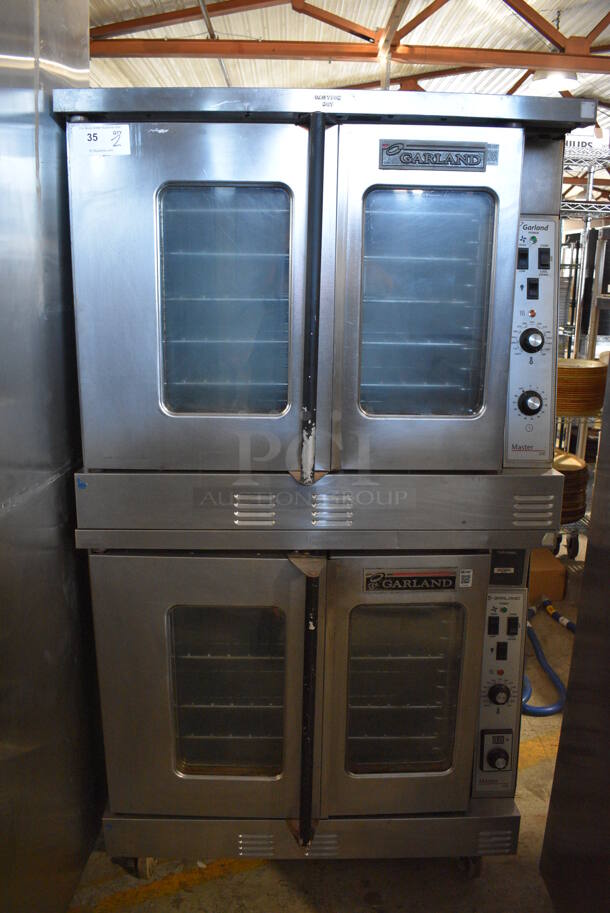 2 LATE MODEL! Garland Master 200 Stainless Steel Commercial Natural Gas Powered Full Size Convection Oven w/ View Through Doors, Metal Oven Racks and Thermostatic Controls. 38x38x71. 2 Times Your Bid!