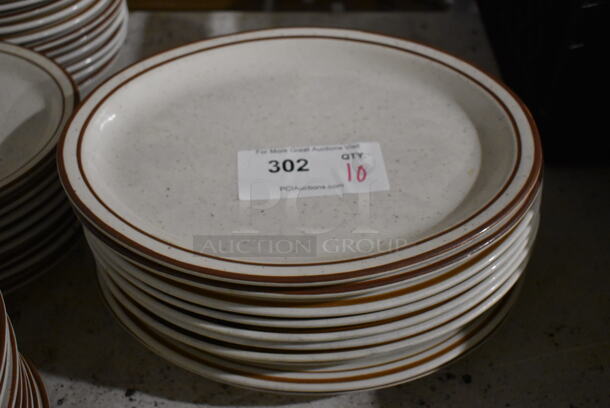 10 White Ceramic Oval Plates w/ Brown Lines on Rim. 13x10.5x1. 10 Times Your Bid!