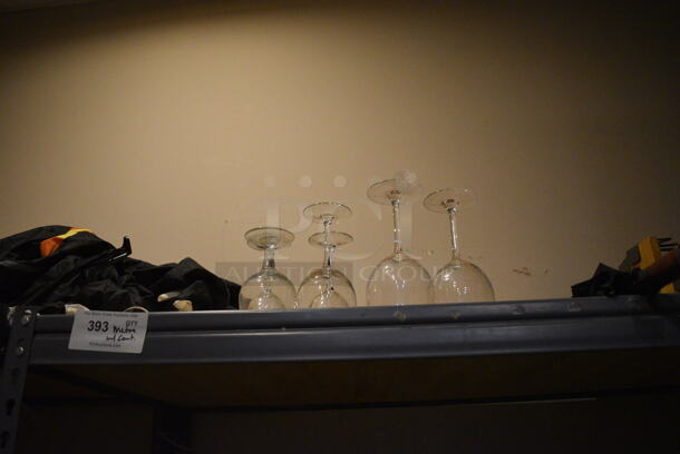 Gray Metal 5 Tier Shelving Unit w/ Contents Including Beverage Glasses and Wine Glasses. 48x24x72. BUYER MUST REMOVE; BUYER MUST DISMANTLE. PCI CANNOT DISMANTLE FOR SHIPPING. PLEASE CONSIDER FREIGHT CHARGES. (glass room - off of bar area) - Image 2 of 10