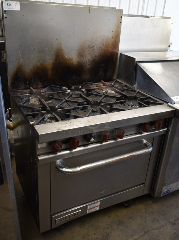 Vulcan Stainless Steel Commercial Natural Gas Powered 6 Burner Range w/ Oven and Back Splash.  - Image 1 of 6
