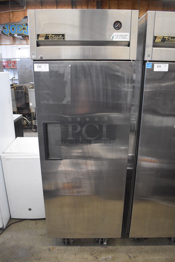 2010 True TG1R-1S Stainless Steel Commercial Single Door Reach In Cooler w/ Poly Coated Racks on Commercial Casters. 115 Volts, 1 Phase. 29x35x83. Tested and Working!