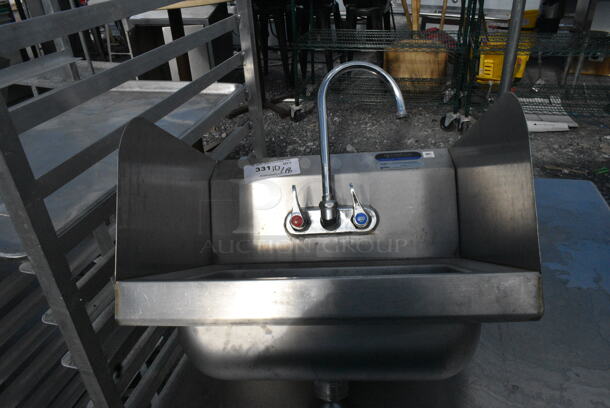 Stainless Steel Single Bay Wall Mount Sink w/ Faucet, Handles and Side Splash Guards.  - Image 1 of 4