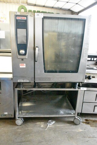 2017 Rational SCC WE 102G Stainless Steel Commercial Natural Gas Powered Self Cooking Center Combi Convection Oven on Equipment Stand w/ Commercial Casters. 170,000 BTU.  