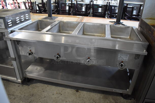 Duke EP304 M Stainless Steel Commercial Electric Powered 4 Bay Steam Table w/ Under Shelf on Commercial Casters. 208 Volts, 1 Phase. 60x29.5x33