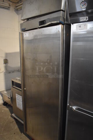 Norlake NR1SS Stainless Steel Commercial Single Door Reach In Cooler w/ Poly Coated Racks. 115 Volts, 1 Phase. 28x34x83.5. Tested and Powers On But Does Not Get Cold