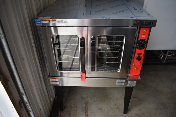 	BRAND NEW! Vulcan Model VC5ED Stainless Steel Commercial Electric Powered Full Size Convection Oven w/ View Through Doors, Metal Oven Racks and Thermostatic Controls on Metal Legs. 208 Volts, 3/1 Phase. 40.5x31.5x55
