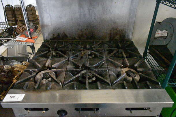 Garland SunFire Stainless Steel Commercial Natural Gas Powered 6 Burner Range w/ Oven, Back Splash and Contents on Commercial Casters.  - Image 2 of 7
