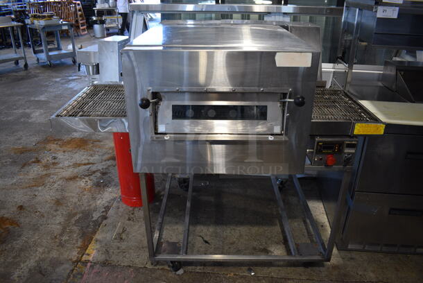 Doyon FC-1 Stainless Steel Commercial Floor Style Electric Powered Conveyor Pizza Oven on Commercial Casters. 208 Volts. 59x44x49
